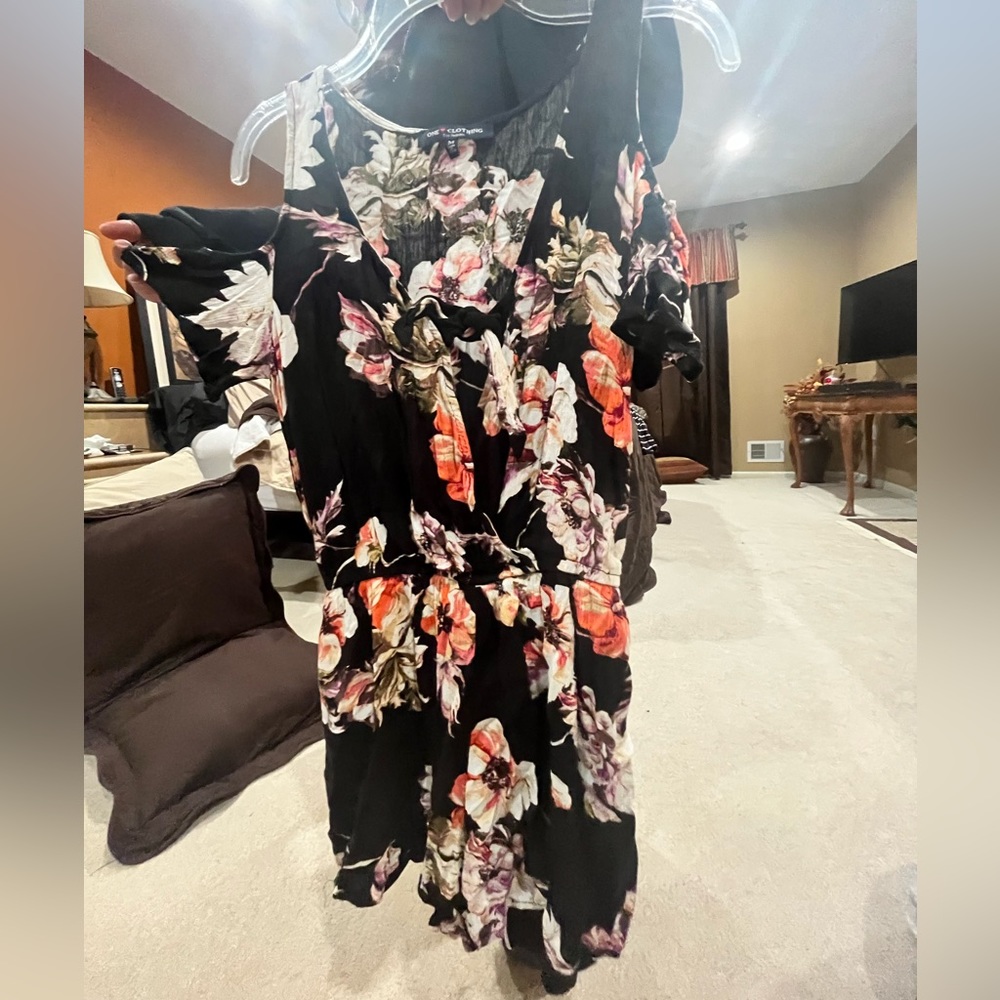 floral romper with sleeves that hang off shoulder